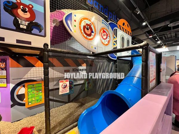 Modular climbing structure with multiple levels for challenging play and skill development.