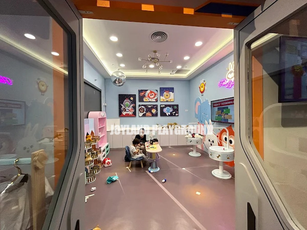 Parent-friendly viewing area with comfortable seating for supervision while children play.