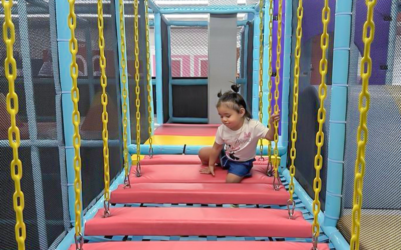 Indoor play facility layout supporting multiple income streams