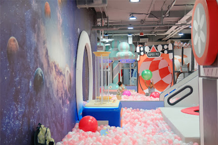 Colorful ball pit area in indoor playground equipment for home commercial spaces.