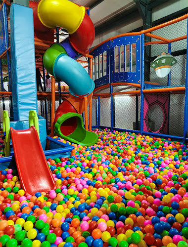 Donut slide in an indoor playground project for India, designed to engage and delight children.