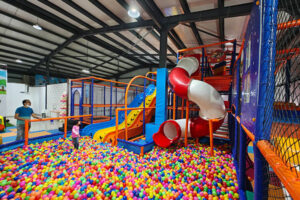 Main play area in an indoor playground opened in India, featuring soft play and colorful zones.