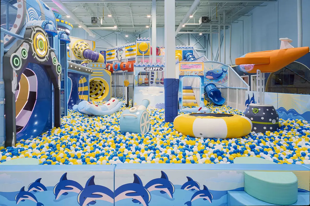 Zhenghan indoor trampoline park and play arena featuring large jumping areas, orange padding, and a multi-level climbing structure.